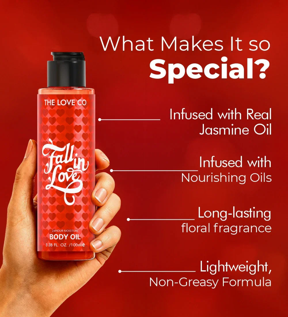 Hand holding The Love Co Fall in Love body oil, red heart bottle, body oil benefits listed