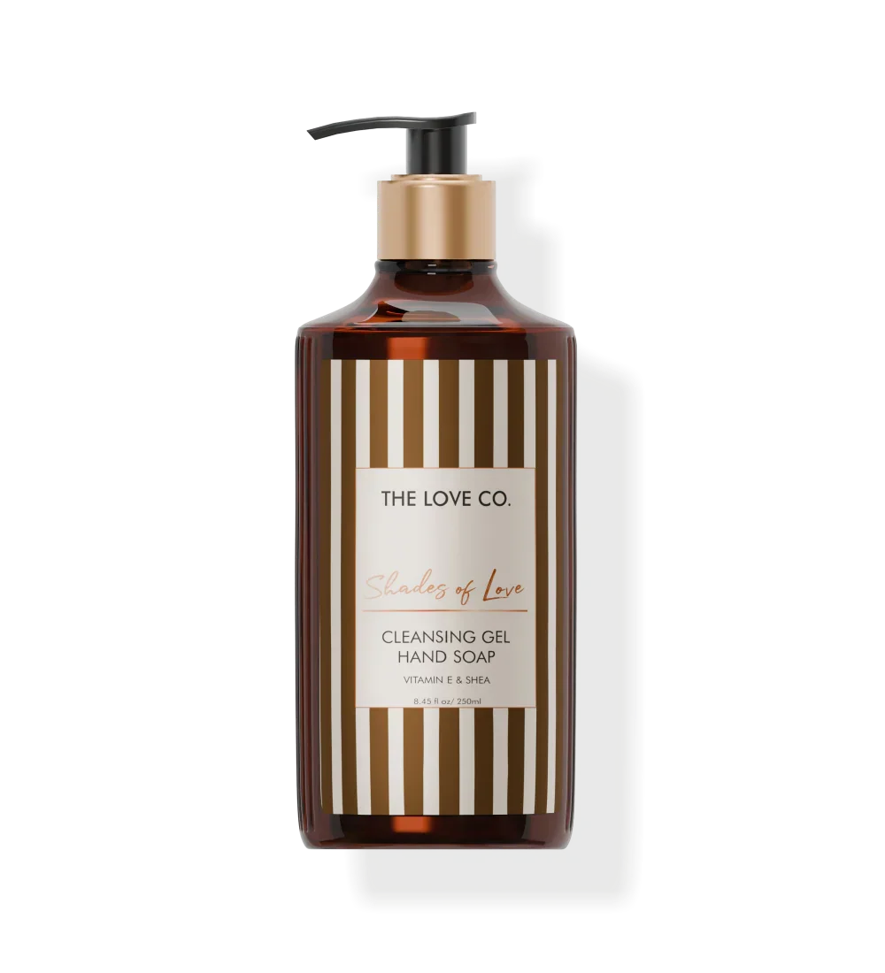 The Love Co. Shades of Love hand wash bottle with gold pump and striped label