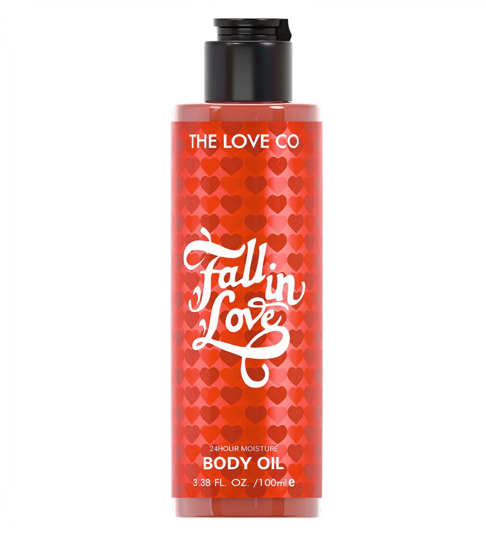 Body oil bottle with red heart pattern and 'The Love Co' branding on a white background