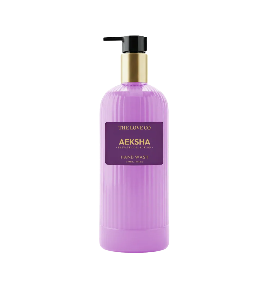 Aeksha Hand Wash by The Love Co in a purple bottle with gold pump dispenser