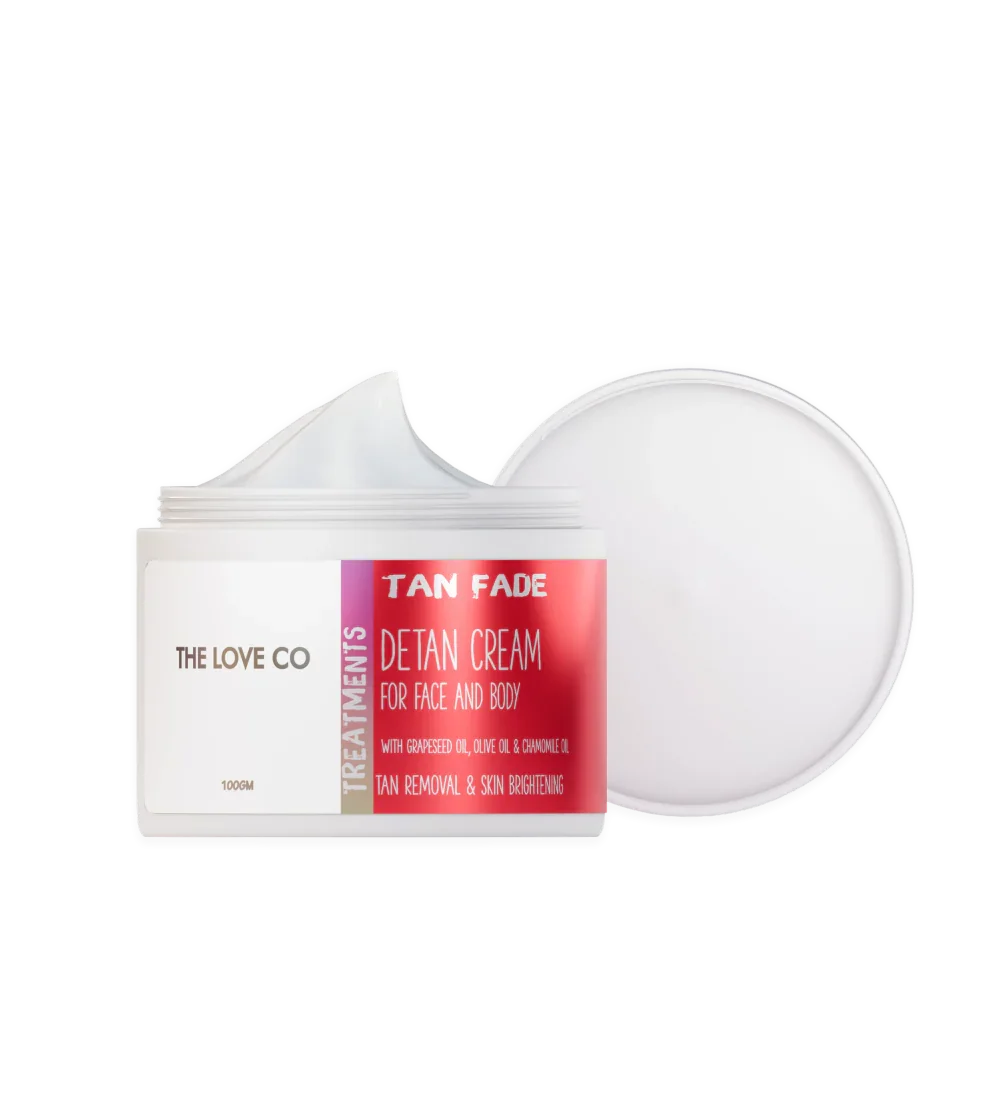 The Love Co Tan Fade detan cream for face and body, open jar with white cream and lid
