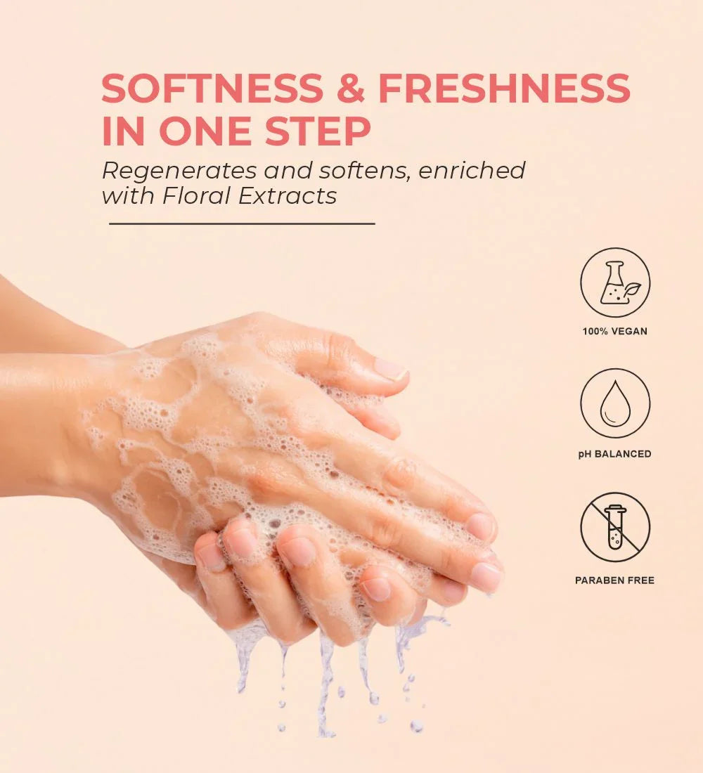 Hands washing with foaming floral hand wash, vegan, pH balanced, paraben free, soft pink background.
