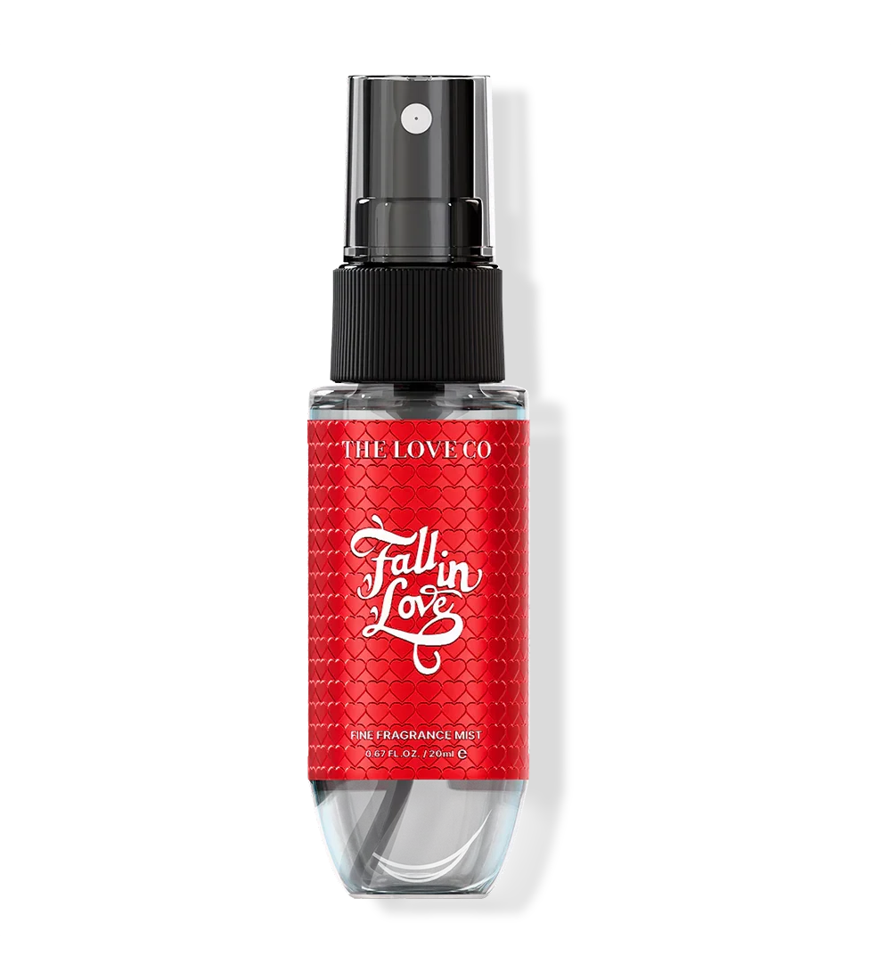 Red mist bottle with black nozzle labeled 'Fall In Love' on a white background
