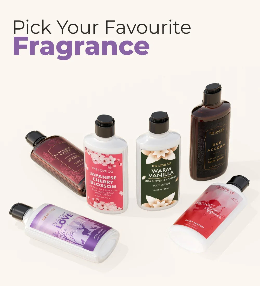 The Love Co body lotion bottles in various fragrances arranged on a light background