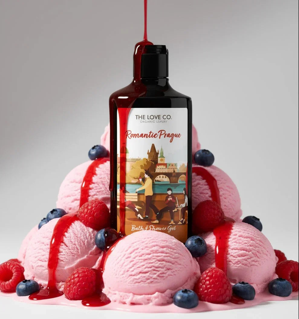 Romantic Prague body wash bottle on pink ice cream with berry sauce, raspberries and blueberries