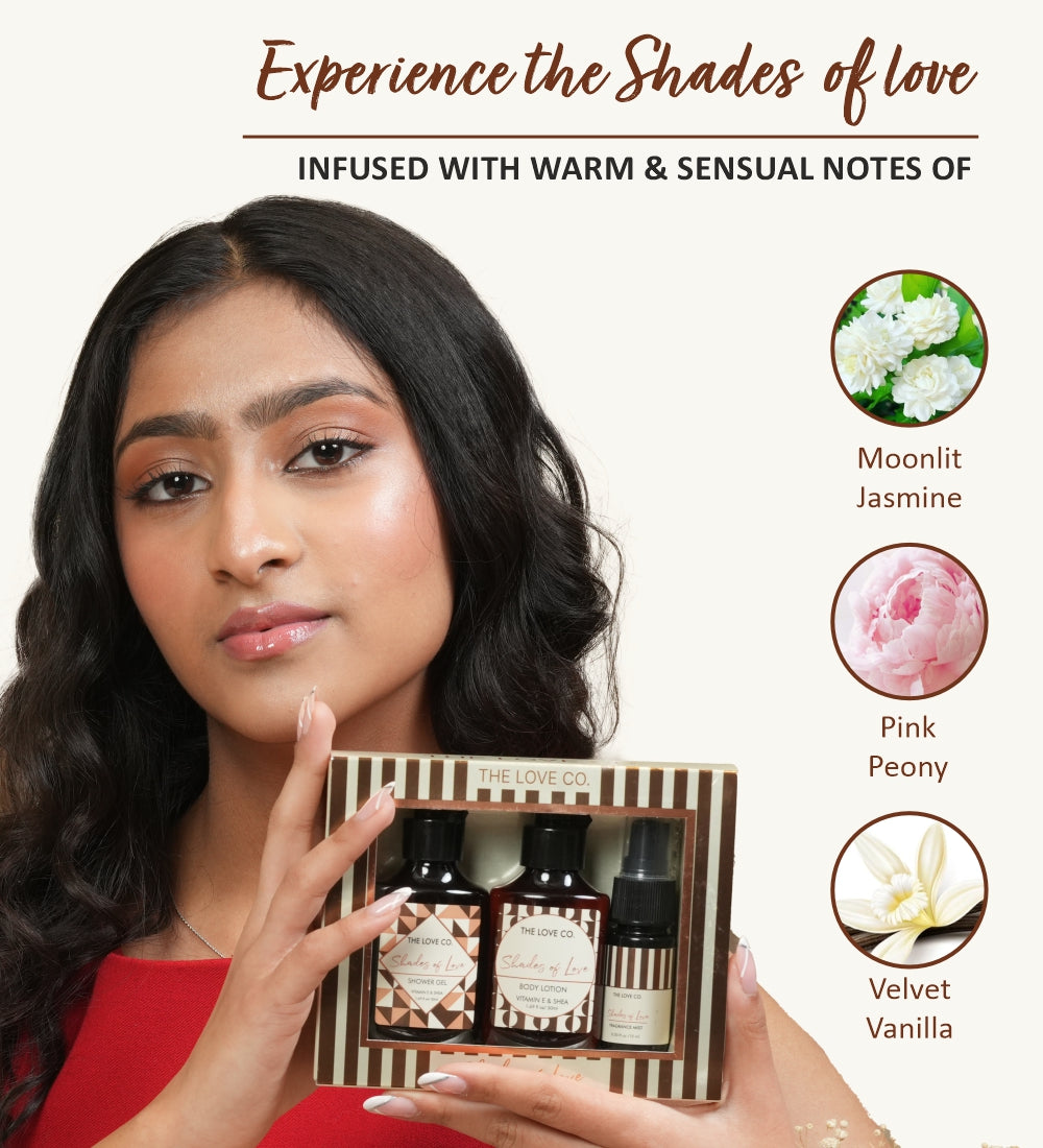 Woman presenting The Love Co. Shades of Love products with notes of Moonlit Jasmine, Pink Peony, and Velvet Vanilla