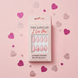Pink press-on nails set in box with glitter hearts on pastel pink background