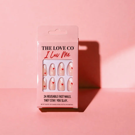 The Love Co I Luv Me reusable press-on nails with red heart design in pink packaging