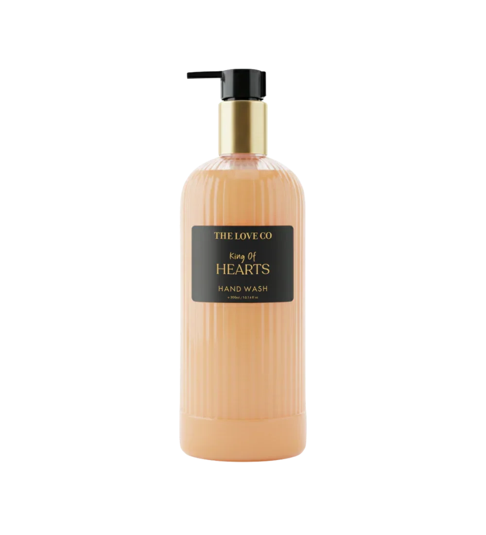 The Love Co King of Hearts hand wash bottle with gold pump and ribbed peach container
