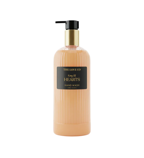 The Love Co King of Hearts hand wash bottle with gold pump and ribbed peach container
