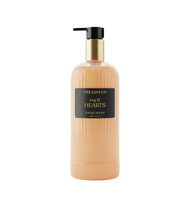 The Love Co King of Hearts hand wash bottle with gold pump and ribbed peach container