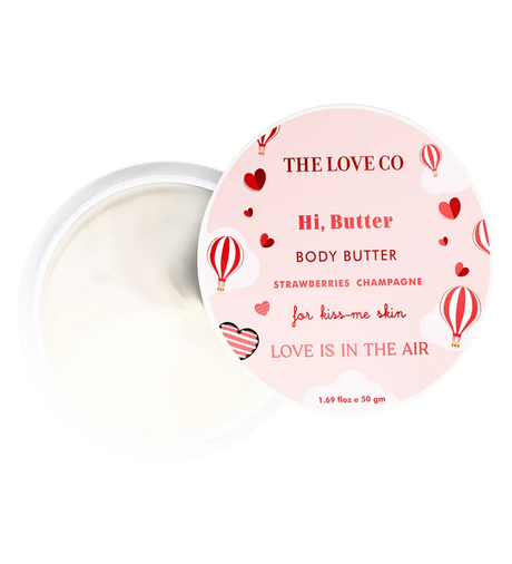 The Love Co Hi Butter Body Butter open jar with pink lid, strawberries champagne scent, red hot air balloons and hearts design.