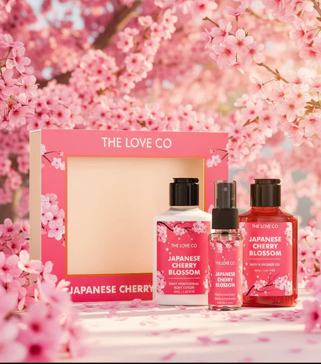Japanese Cherry Blossom body care gift set by The Love Co with pink blossoms background