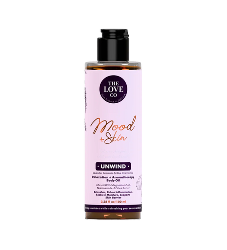 The Love Co Mood + Skin Unwind aromatherapy body oil bottle with lavender and chamomile.