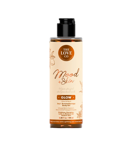 The Love Co Mood + Skin Glow body oil bottle with citrus and neroli aromatherapy.