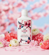 Body lotion bottle with cherry blossom design on a floral background