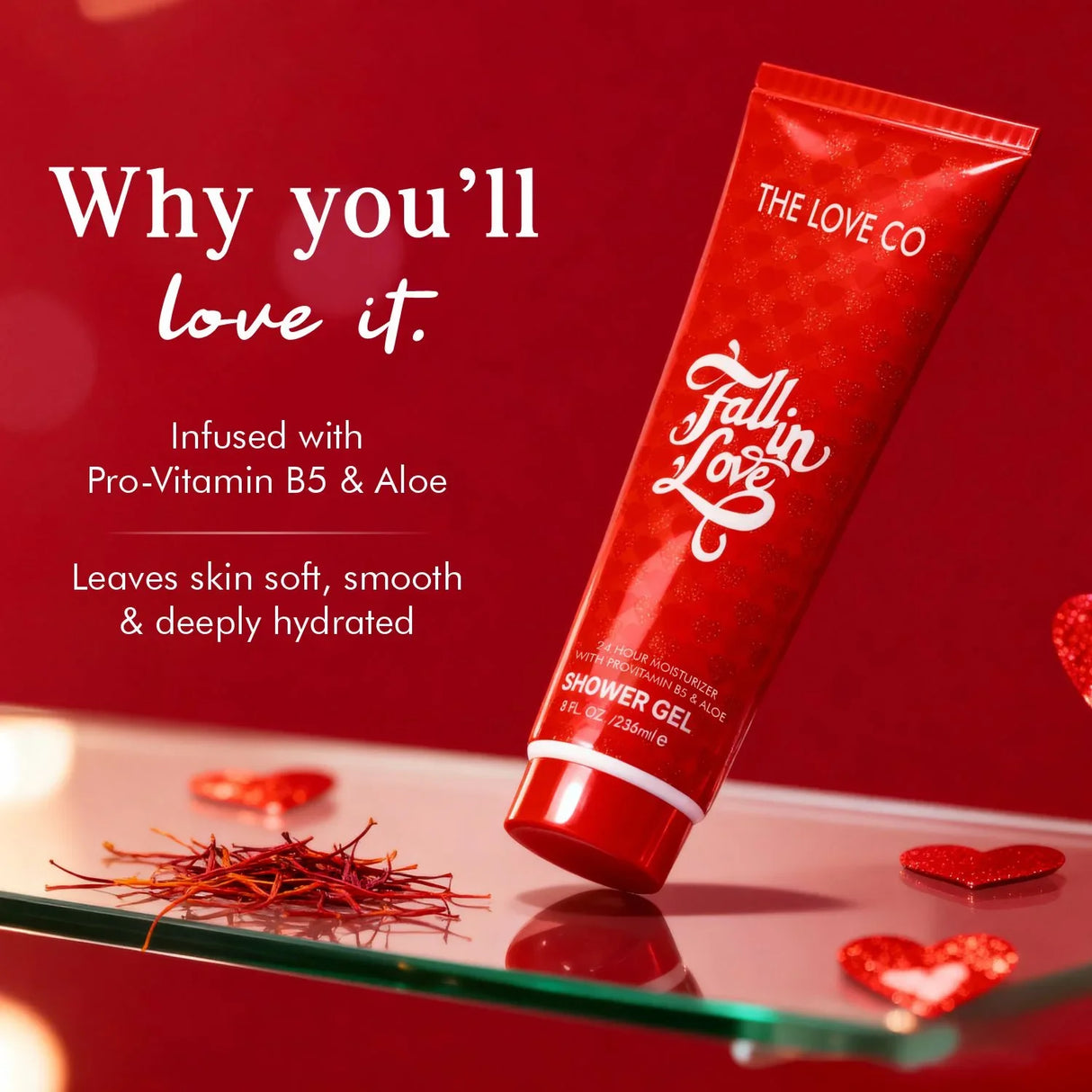 Fall In Love Shower Gel by The Love Co, red tube on glass with heart decorations, saffron strands