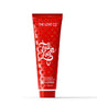 The Love Co Fall in Love body lotion 236ml red tube with gold hearts on white background