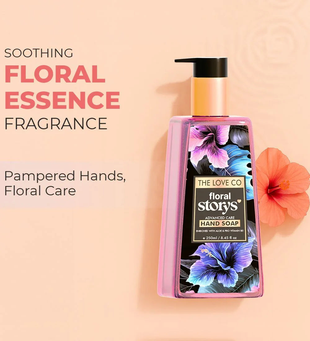 The Love Co floral essence hand soap with floral print bottle and hibiscus flower on peach background