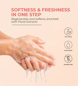 Hands washing with foaming floral hand wash, vegan, pH balanced, paraben free, soft pink background.