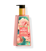The Love Co Rose Story hand soap bottle with floral label and gold pump dispenser.