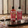 The Love Co Japanese Cherry Blossom shower gel and body lotion on tray with cherry blossoms