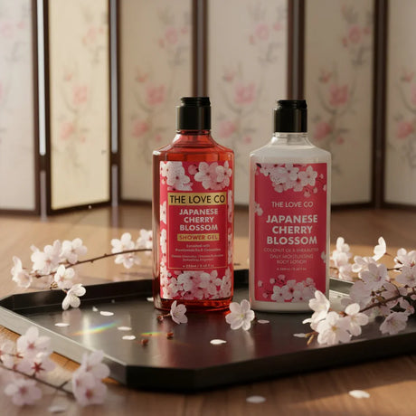 The Love Co Japanese Cherry Blossom shower gel and body lotion on tray with cherry blossoms