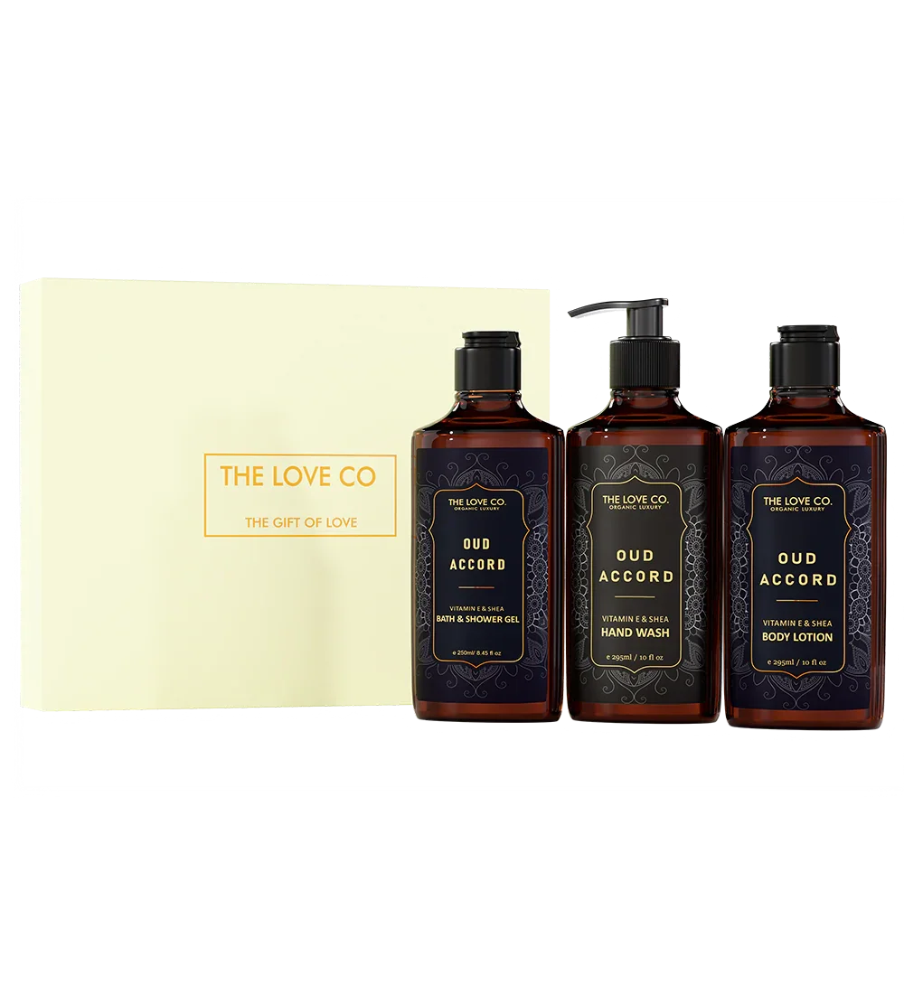 The Love Co Oud Accord gift box with bath and shower gel, hand wash, and body lotion bottles