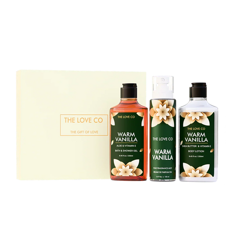 The Love Co white gift box with Warm Vanilla bath and body set, featuring shower gel, mist, and lotion.