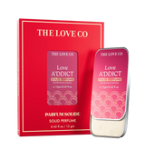 Love A'ddict Solid perfume by The Love Co with red packaging on a white background