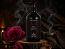 Oud of Love Body Lotion on a wooden slice with incense smoke, rose, saffron and agarwood – view 2