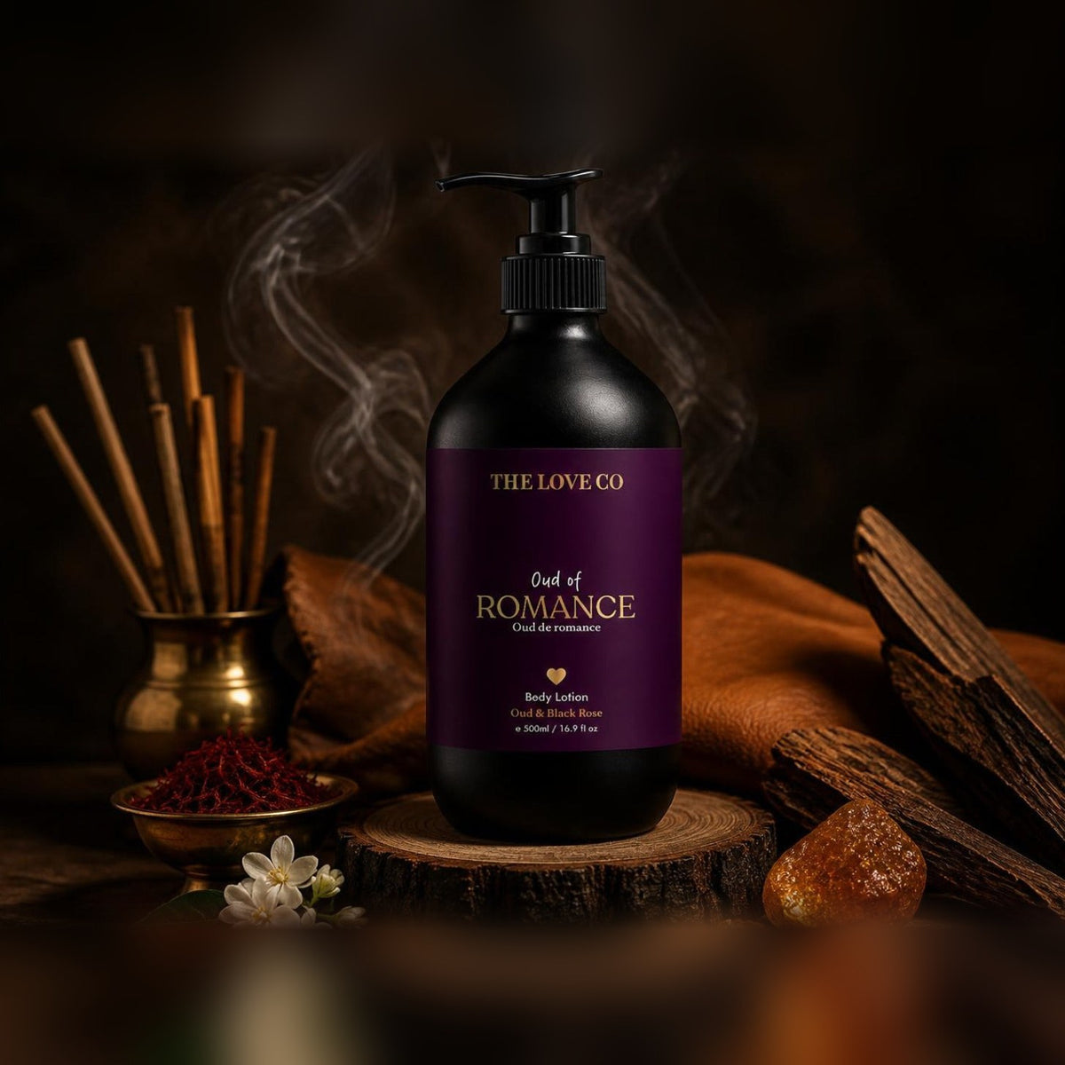 Oud of Romance Body Lotion on a wooden slice with incense smoke, saffron, papyrus, jasmine and leather