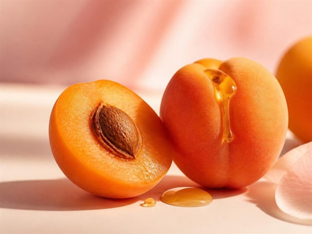 Ripe apricots with nectar